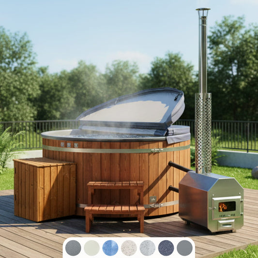 Round wood-fired hot tub with external stainless steel heater, open cover and wooden steps on a terrace